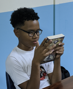 Middle School students finding just right books during a readers workshop