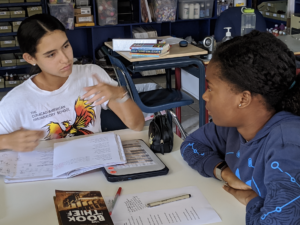 Two students discussing the poem a Poison Tree